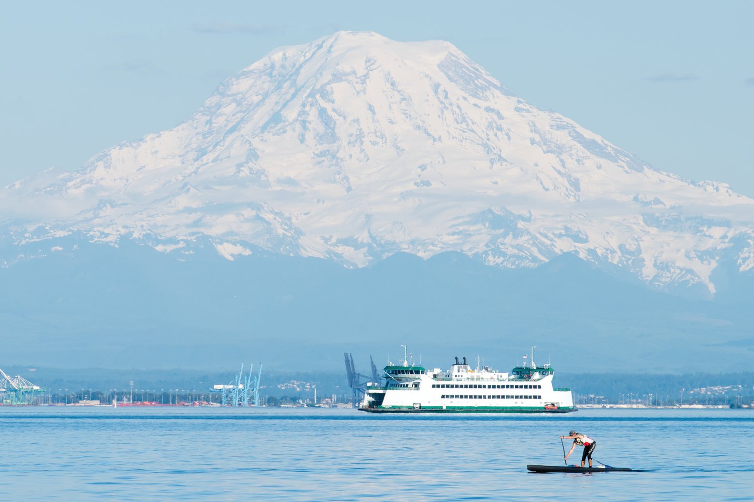 Above, Mount Rainier and a ferry loom behind a Seventy/48 participant.